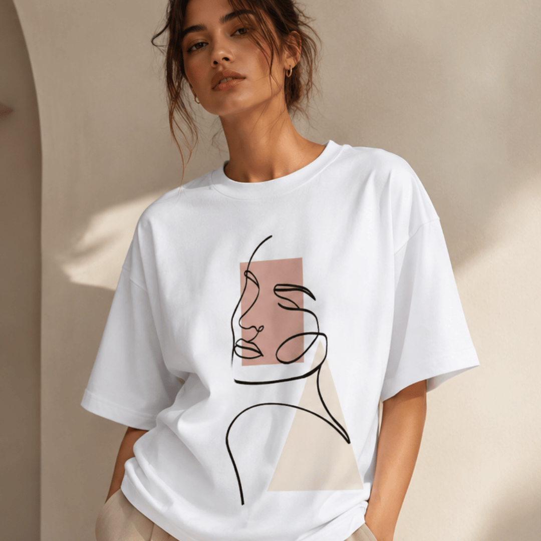 Evoke minimalist face line art oversized white cotton tee for women — standing close-up graphic view