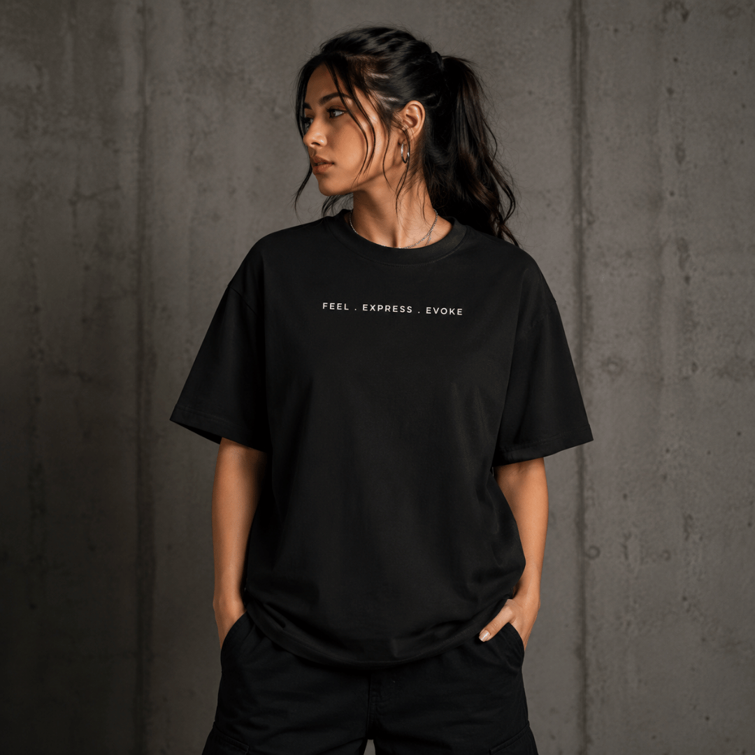 Evoke gender-neutral oversized graphic t-shirt in black – front view with FEEL EXPRESS EVOKE chest print, size-inclusive S to 2XL