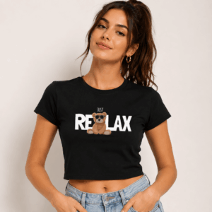 Just Relax black cropped graphic tee for women — front view of teddy bear RE LAX print, bio-wash baby tee by Thread Evoke