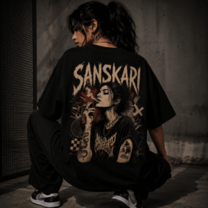 Sanskari oversized t-shirt for women — back graphic print with dark art illustration, model in crouching pose | Thread Evoke