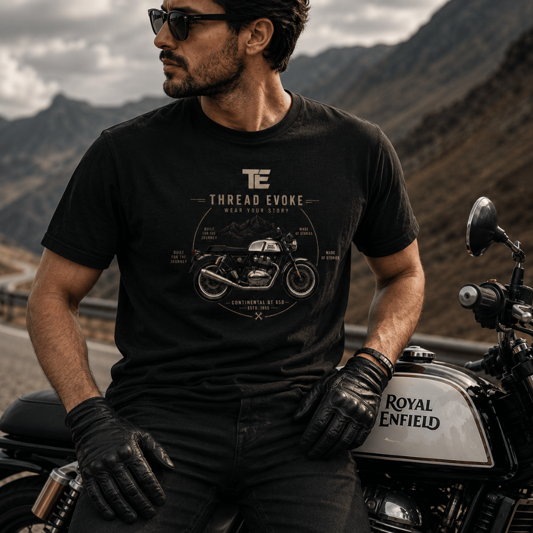 Thread Evoke Continental GT 650 biker t-shirt — premium Royal Enfield graphic tee worn by rider on mountain highway, ESTD 1955 design